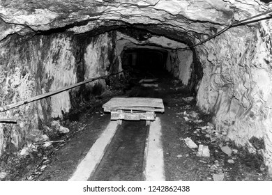 Mining cart in an abandoned cement mine in Switzerland - Shutterstock ID 1242862438