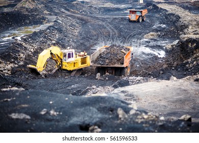 Mining dump trucks working in Lignite coalmine