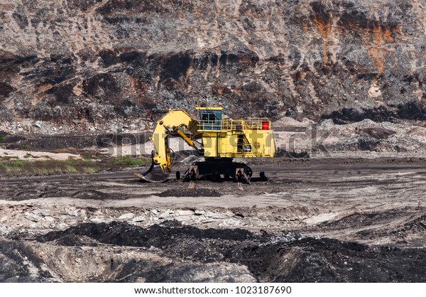 Mining Equipment or Mining\
Machinery, Bulldozer, wheel loader, shovels, loading of coal, ore\
on the dump truck from open-pit or open-cast mine as the Coal\
Production.