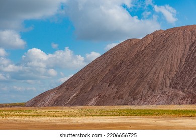 Mining industry close up. Telestacker handles the ore closeup for potash waste heaps, extraction of salt and potash fertilizers in a quarry and processing of ore
