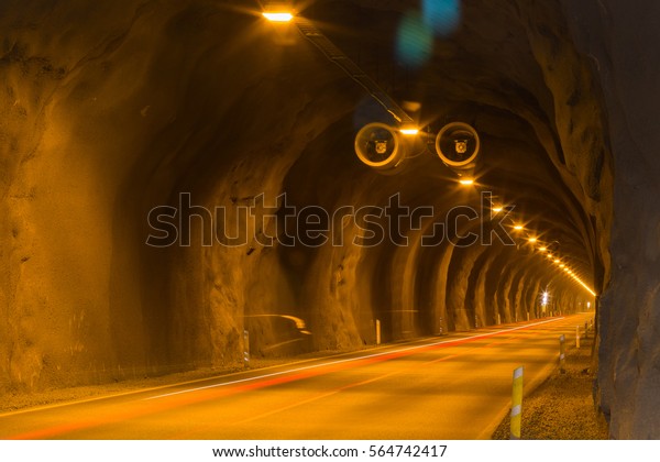 Mining infrastructure: tunnel with light trails\
of car traffic. This underground road connects Faskrudsfjordur and\
Reydarfjordur in East\
Iceland.