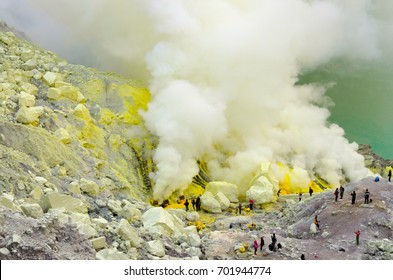 Mining Pure Sulfur In The Smoking Crater Of Mt. Ijen, East Java, Indonesia.