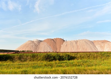 Mining Of Salt And Potassium Salts. Summer Landscape Of The Salt Mountains On The Blue Sky Background. Extraction Of Silica From The Ground. Mining Industry Landscape. Potassium Salt Background.