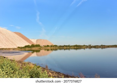 Mining Of Salt And Potassium Salts. Summer Landscape Of The Salt Mountains On The Blue Sky Background. Extraction Of Silica From The Ground. Mining Industry Landscape. Potassium Salt Background.