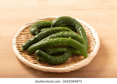 Mini-sized cucumbers in a colander