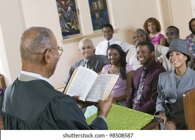 Minister Giving Sermon in Church