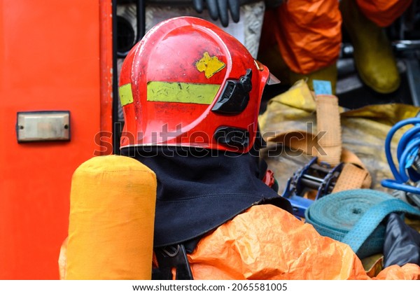 Ministry of Emergency Situations. An Emergencies
Ministry employee in special clothing takes out the equipment for
extinguishing the fire from the car. Fire extinguishing equipment.
Gomel. Belarus