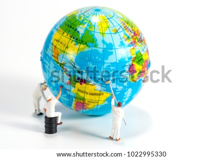 miniture people cleaning the world
