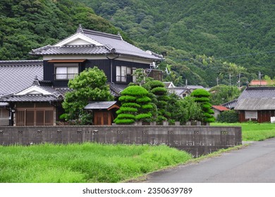 "Minka" a traditional Japanese houses, are characterized by tatami mat flooring, sliding doors, and wooden engawa verandas - Shutterstock ID 2350639789