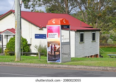 Minmi, New South Wales Australia – November 24, 2021 Telstra phone box outside the Minmi hall