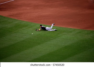 MINNEAPOLIS - JULY 17:  White Sox second baseman Gordon Beckham dives while attempting to make a play but misses in a game against the Twins at Target Field July 17, 2010 in Minneapolis, MN.