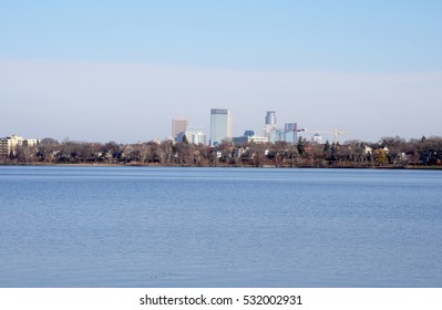 Minneapolis Minnesota Skyline Standing Tall Over Lake Calhun. Known As The Land Of 10,000 Lakes. Join St. Paul As Twin Cities Split By Mississippi River.