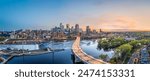 Minneapolis, Minnesota, USA downtown city skyline over the river at dusk.