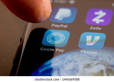 MINNEAPOLIS, MINNESOTA / USA - JULY 7, 2019: Person Using Apple I-phone To Press And Access The Circle Pay App / Application