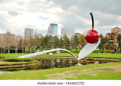 Minneapolis, Minnesota, USA - May, 07, 2011: Group Of Asian Traveler Or Friends  Sightseeing Or Relaxing On Weekend At Spoon Cherry Or Sculpture Garden