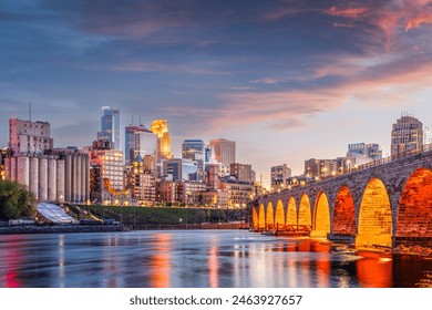 Minneapolis, Minnesota, USA skyline with the Stone Arch Bridge on the Mississippi River at dusk. - Powered by Shutterstock