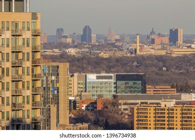 MINNEAPOLIS, MN - MARCH 2018 - A Telephoto Shot Of The St. Paul Skyline Compressed Against High Rise Apartments In Minneapolis During A Late Fall Golden Hour