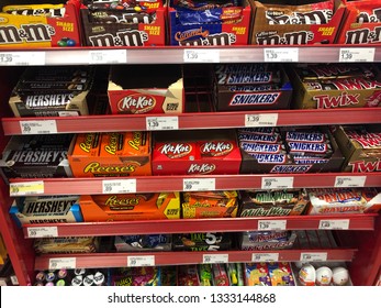 Minneapolis, MN - March 8, 2019: Candy Bar Display At A Retail Grocery Store Checkout Aisle. Concept For Impulse Buying, Various Brands Of Candy Shown