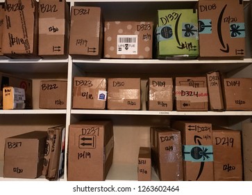 Minneapolis, MN/USA. December 20th, 2018. A Mailroom Full Of Packages A Few Days Before Christmas At An Apartment Complex In Minnesota.