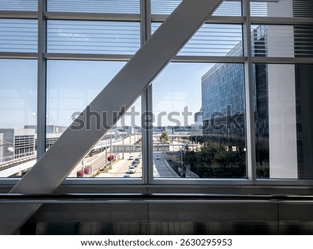 Minneapolis Saint Paul Airport’s terminal, framed by large windows and structural beams. MSP is a major airline hub in the Midwest, in minnesota, united states.