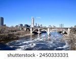 Minneapolis Stone Arch Bridge and City Skyline