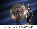 Minnesota US state flag with statue of lady justice and judicial scales in dark room. Concept of judgement and punishment, background for jury topics