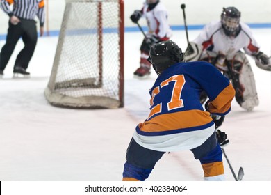 Minor Ice Hockey Kids Playing In A Game