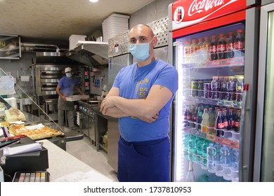 Minori,Sa,Italy - May 21,2020 :The Owner Of A Deli And Pizzeria To Take Away In His Premises To The Reopening Of The Commercial Activity During The Phase 2 Of The Emergency From Covid-19 . 