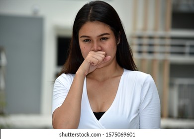 A Minority  Asian Female Coughing - Shutterstock ID 1575069601