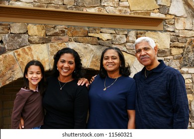 Minority Family Standing In Their Home