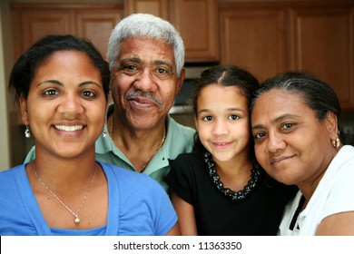 Minority family standing in their kitchen