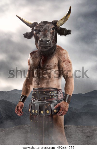 Minotaur standing on mountain landscape.