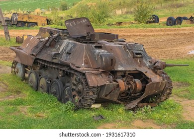 Minsk, Belaraus - October 2, 2012: An Old Broken Tank Of The Second World War Model Is Rusting In The Field. Belarusian Historical Museum The Stalin Line