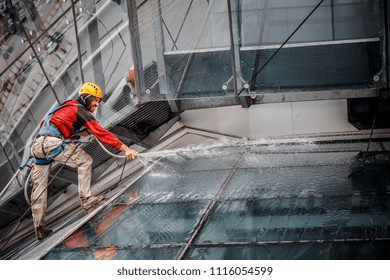 MINSK, BELARUS - 02 JUNE. 2018: group of workers cleaning windows service on high rise building. work on the heights , industrial mountaineering - Shutterstock ID 1116054599
