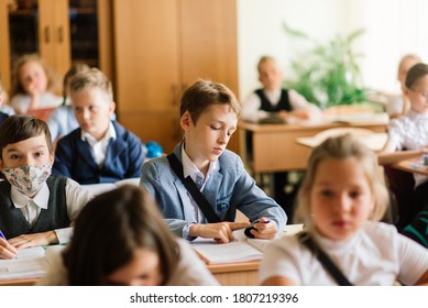 Minsk, Belarus - 09.01.2020. Elementary schoolchildren writing in books in the classroom - Shutterstock ID 1807219396