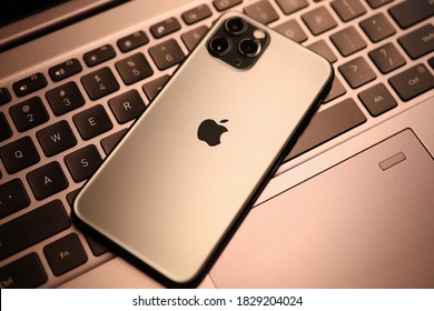 Minsk, Belarus - 30 July 2020 : New Model Apple Iphone Lies On Laptop Keyboard Closeup. Illustrative Editorial