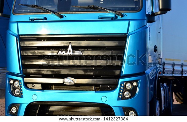 Minsk, Belarus,\
31.May.2019: The logo of the truck Minsk Automobile Plant  and the\
exterior cabin close-up of the released the new generation truck\
MAZ-5440M9 with Euro-6\
engine