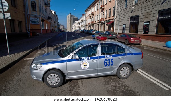 Minsk, Belarus - 8 Mar 2019. Police car blocking\
Volodarskogo street road during the women\'s marathon dedicated to\
the celebration of international women\'s day. Traffic police keep\
law and order