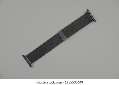 Minsk, Belarus - April 14, 2021: Black Metal Apple Watch Strap On A Gray Background.