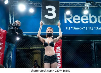 Minsk, Belarus, April 25, 2020. New Fighting Generation, Mixed Martial Arts. Mma, Girl Model In A Black Leather Suit  And Medical Mask In The Ring, In The Octagon, Announcement Of The Round