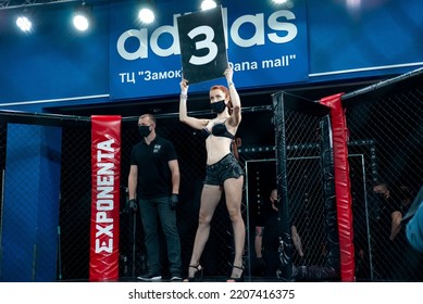 Minsk, Belarus, April 25, 2020. New Fighting Generation, Mixed Martial Arts. Mma, Girl Model In A Black Leather Suit  And Medical Mask In The Ring, In The Octagon, Announcement Of The Round