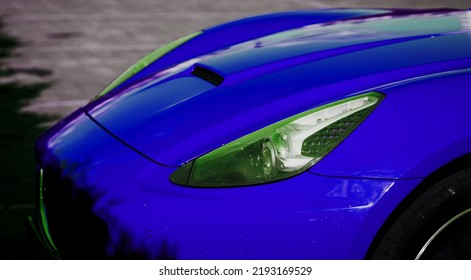 Minsk, Belarus, August 2022 - Headlight Of A Luxury Blue Sportscar. Supercar In The Parking Lot