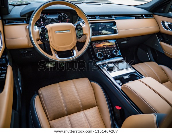 MINSK, BELARUS - AUGUST 7, 2018: Photo of\
Range Rover Velar\'s interior. Interior features caramel-browm\
leather trim on seats and dashboard. Range Rover Velar’s cabin\
exudes elegant\
simplicity.