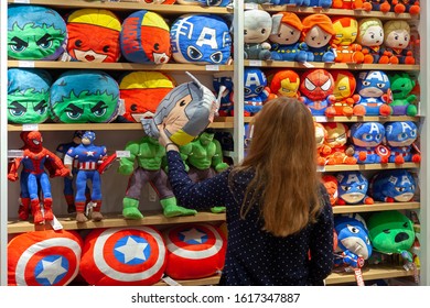 MINSK, BELARUS - December 20, 2019: Buyer Chooses Toys Superheroes Of Marvel Universe Made By Miniso.