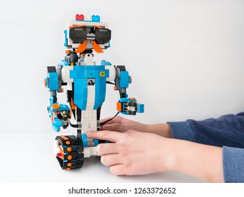 Minsk, Belarus. December, 2018. Robot policeman with handcuffs made of Lego Boost. Little robots. The best toy for children and teenagers. Programmable toy. STEM education. Like. White background. DIY
