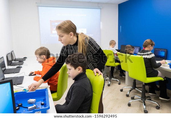 Minsk, Belarus. December, 2019. Boys and girls\
construct and code Lego WeDo 2.0 robot. STEM and STEAM education.\
Robotics class for child and teen.\
