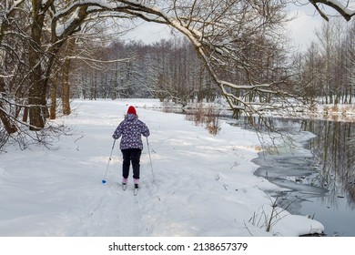 Minsk, Belarus - February 11, 2018: Active Winter Holidays. An Older Woman Skis In Nature In Winter .