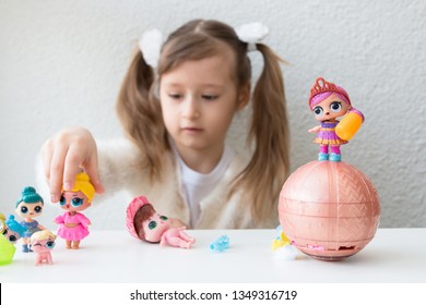 girls playing with lol dolls