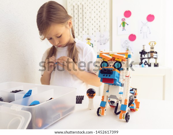 Minsk,\
Belarus. February, 2019. STEM and STEAM education. Cute little girl\
code robot in the class of engineering and chemistry on Scratch.\
Lego Boost. Modern technologies.\
Robotics.