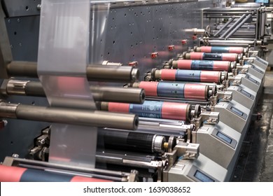 MINSK, BELARUS - JANUARY 2020: Rows Of Large Offset Printing Press. Moving Polymer Label Conveyor Typography Facility And Flexographic Printing